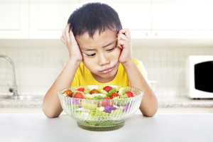 Unhappy Child To Eat Salad